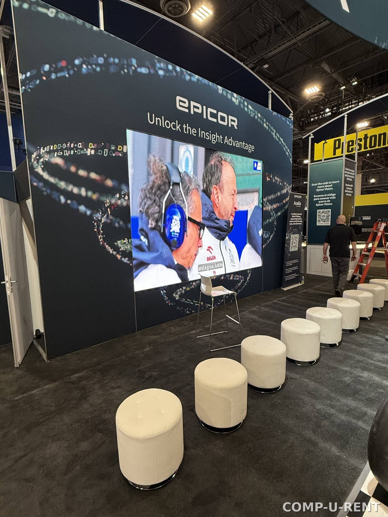 Large-format video wall display at a trade show booth