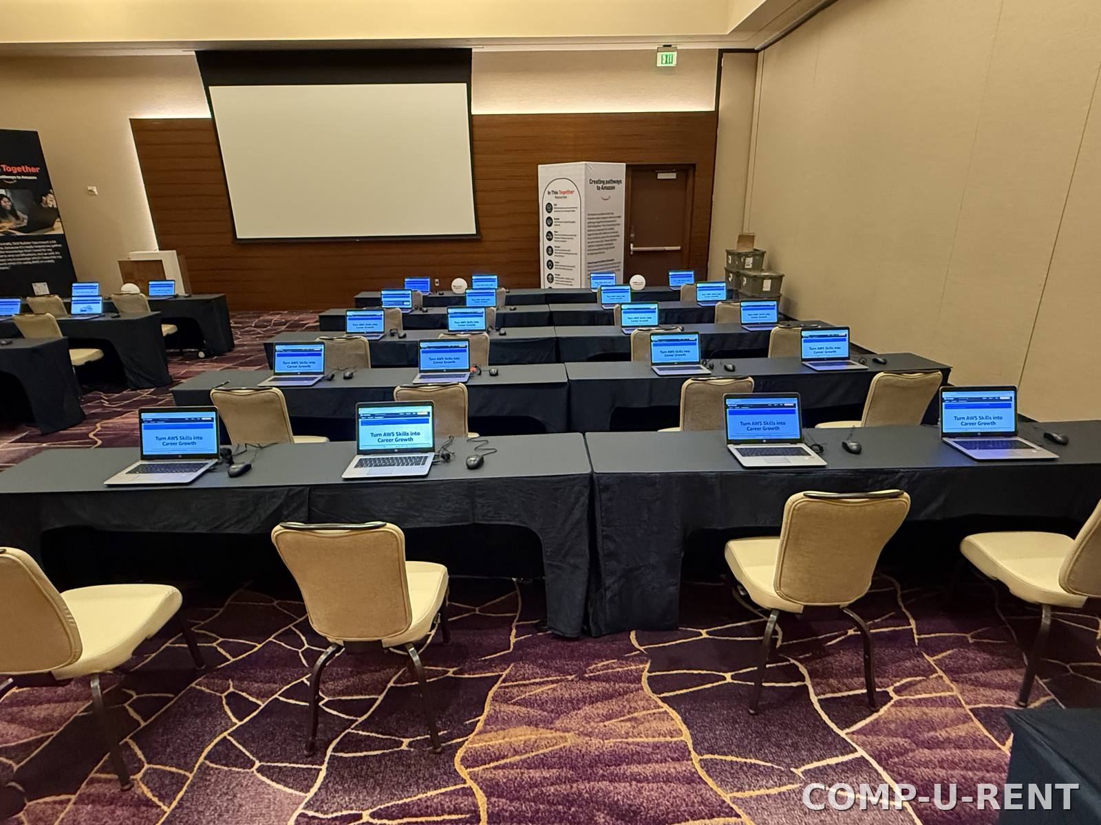 Rows of laptop rentals configured for a training session