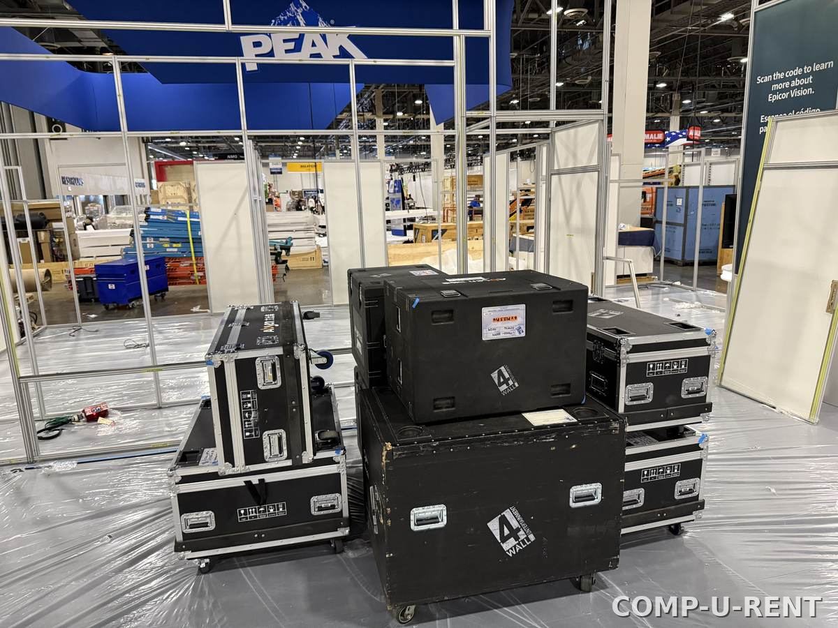 Stacked flight cases of AV equipment ready for load-in